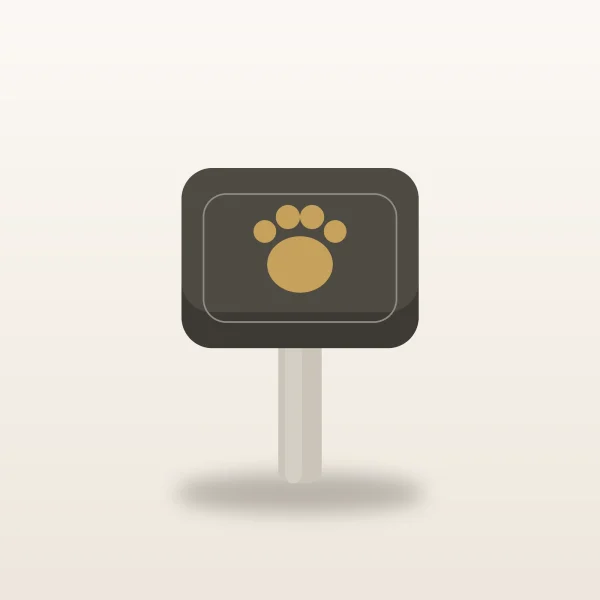 Slate pet memorial garden marker with a short stake and an engraved gold paw outline on a warm ivory surface