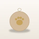Flat wooden pet memorial ornament with a paw outline and a twine loop, on a warm ivory surface